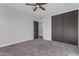 Well-lit bedroom with double door closet and plush carpeting at 12222 N 74Th St, Scottsdale, AZ 85260