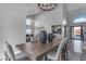 Elegant dining room with a large wooden table, modern chairs, and statement art at 12222 N 74Th St, Scottsdale, AZ 85260