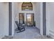 Inviting entryway with rocking chairs and stylish door at 12222 N 74Th St, Scottsdale, AZ 85260
