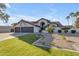 Three-car garage and expansive front yard at 12222 N 74Th St, Scottsdale, AZ 85260