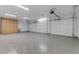 Two-car garage with epoxy flooring and ample storage at 12222 N 74Th St, Scottsdale, AZ 85260
