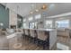 Modern kitchen with large island, stainless steel appliances, and white quartz countertops at 12222 N 74Th St, Scottsdale, AZ 85260