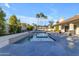 Inviting pool area with palm trees and patio at 12222 N 74Th St, Scottsdale, AZ 85260