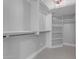 Bright walk-in closet with ample shelving and hanging space at 12222 N 74Th St, Scottsdale, AZ 85260