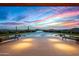 Infinity pool with mountain views at sunset at 42515 N 102Nd St, Scottsdale, AZ 85262