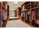 Large walk-in Primary closet with ample shelving and hanging space at 42515 N 102Nd St, Scottsdale, AZ 85262