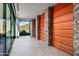 Bright entryway with glass doors and wood wall paneling at 42515 N 102Nd St, Scottsdale, AZ 85262