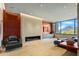 Common area with fireplace, seating, and mountain views at 42515 N 102Nd St, Scottsdale, AZ 85262