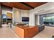 Living area with a contemporary fireplace and built-in entertainment center at 42515 N 102Nd St, Scottsdale, AZ 85262