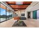 Spacious living room with floor-to-ceiling windows, fireplace, and high ceilings at 42515 N 102Nd St, Scottsdale, AZ 85262