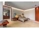 Modern bedroom with ensuite closet and wood flooring at 42515 N 102Nd St, Scottsdale, AZ 85262