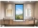 Modern bathroom with double vanity and mountain views at 42515 N 102Nd St, Scottsdale, AZ 85262