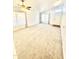 Bright and spacious living room with neutral carpeting and lots of natural light at 1639 E Redfield Rd, Gilbert, AZ 85234