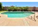 Inviting kidney-shaped pool with a convenient handrail at 1639 E Redfield Rd, Gilbert, AZ 85234