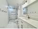 Updated bathroom with modern vanity and walk-in shower at 1639 E Redfield Rd, Gilbert, AZ 85234