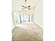 Spacious bedroom with carpeted floors and a ceiling fan at 1639 E Redfield Rd, Gilbert, AZ 85234