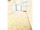 Bright and spacious living room with neutral carpet and large windows at 1639 E Redfield Rd, Gilbert, AZ 85234