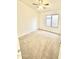 Spacious bedroom with neutral carpeting and a ceiling fan at 1639 E Redfield Rd, Gilbert, AZ 85234