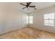 Bright bedroom with ceiling fan and tile flooring at 54 N 194Th Ln, Buckeye, AZ 85326