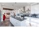 Modern kitchen with island, white cabinets, and open layout at 50381 W Century Rd, Maricopa, AZ 85139