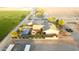 Aerial view of property with house, pool, and stables at 376 N Iron Horse Dr, Coolidge, AZ 85128