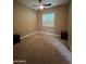 Bright bedroom with carpeted floors and ceiling fan at 376 N Iron Horse Dr, Coolidge, AZ 85128