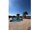 Inviting kidney-shaped pool with waterfall feature at 376 N Iron Horse Dr, Coolidge, AZ 85128