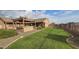 Spacious backyard with lawn and outdoor kitchen at 376 N Iron Horse Dr, Coolidge, AZ 85128