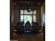 Spacious dining room with a large window and wood table at 376 N Iron Horse Dr, Coolidge, AZ 85128