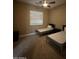 Two twin beds in a well-lit bedroom with carpeted floors at 376 N Iron Horse Dr, Coolidge, AZ 85128