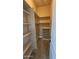 Large walk-in closet with shelving and shoe storage at 376 N Iron Horse Dr, Coolidge, AZ 85128