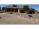 One-story home with stone accents and a landscaped yard at 376 N Iron Horse Dr, Coolidge, AZ 85128