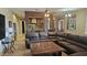 Open floor plan with a large sectional sofa and kitchen views at 376 N Iron Horse Dr, Coolidge, AZ 85128