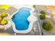 Freeform swimming pool with a concrete deck at 376 N Iron Horse Dr, Coolidge, AZ 85128