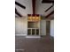 Bedroom with built-in shelving and wood beam accents at 376 N Iron Horse Dr, Coolidge, AZ 85128