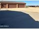 Large driveway with space for multiple vehicles at 376 N Iron Horse Dr, Coolidge, AZ 85128