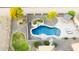 Freeform swimming pool with surrounding landscaping at 376 N Iron Horse Dr, Coolidge, AZ 85128