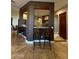 Kitchen features a breakfast bar and granite countertops at 376 N Iron Horse Dr, Coolidge, AZ 85128
