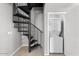 Laundry closet with stackable washer and dryer and spiral staircase at 20100 N 78Th Pl # 2179, Scottsdale, AZ 85255