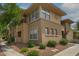 Tan two-story building with large windows and landscaping at 20100 N 78Th Pl # 2179, Scottsdale, AZ 85255