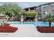 Community pool area with lush landscaping at 20100 N 78Th Pl # 2179, Scottsdale, AZ 85255
