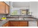 Kitchen with granite countertops, double sink, and wood cabinets at 20100 N 78Th Pl # 2179, Scottsdale, AZ 85255