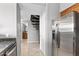 Kitchen with stainless steel refrigerator and access to spiral stairs at 20100 N 78Th Pl # 2179, Scottsdale, AZ 85255