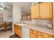 Well-equipped kitchen with ample counter space and wood cabinets at 14950 W Mountain View Blvd # 1203, Surprise, AZ 85374