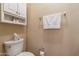 Small bathroom with toilet and wall-mounted cabinet at 14950 W Mountain View Blvd # 1203, Surprise, AZ 85374