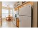 Efficient kitchen with white appliances and ample cabinet space at 14950 W Mountain View Blvd # 1203, Surprise, AZ 85374