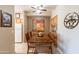 Bright dining area with a wooden table and view of the kitchen at 14950 W Mountain View Blvd # 1203, Surprise, AZ 85374