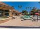 Community pool with spa and lounge chairs at 14950 W Mountain View Blvd # 1203, Surprise, AZ 85374