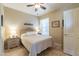 Cozy bedroom with ceiling fan, window, and built-in dresser at 14950 W Mountain View Blvd # 1203, Surprise, AZ 85374