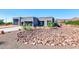 Modern home exterior with two-car garage and landscaped yard at 10569 N 131St St, Scottsdale, AZ 85259